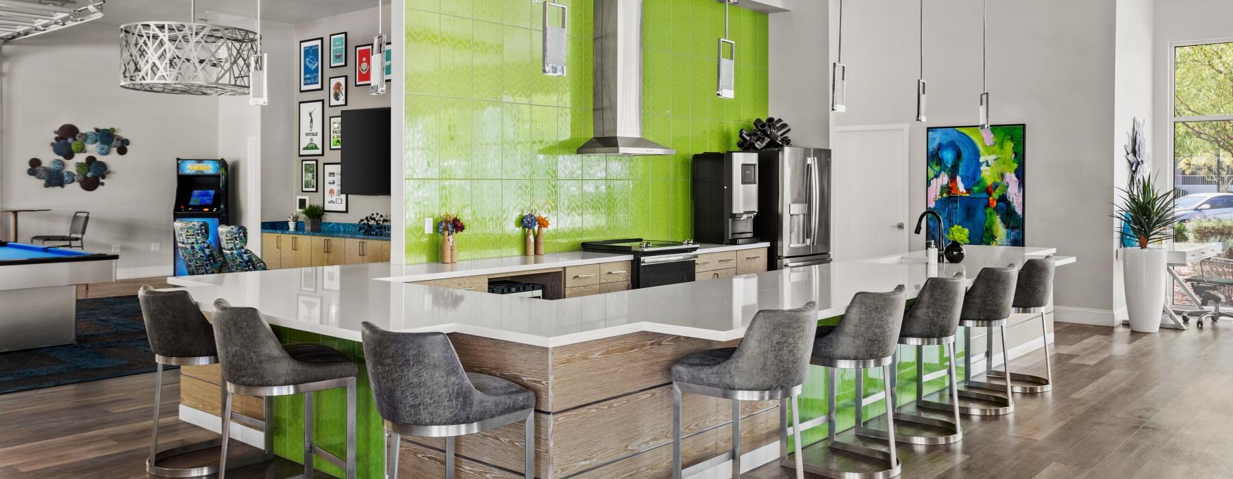 a room with a table chairs and a green screen