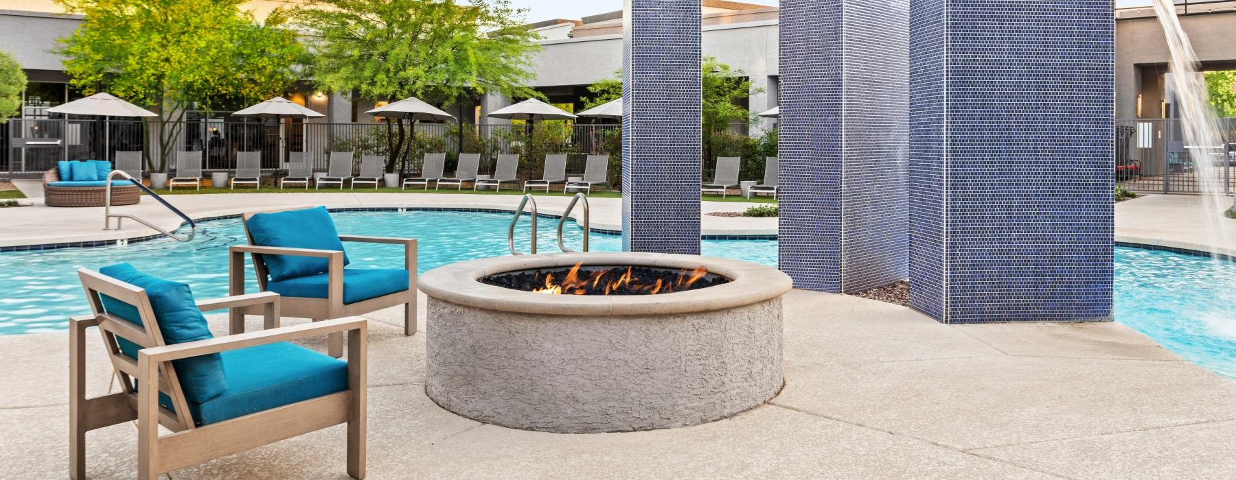 a pool with chairs around it
