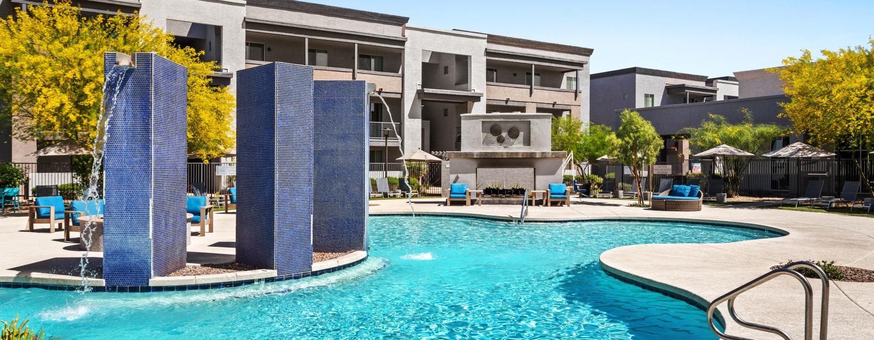 a swimming pool in front of a house